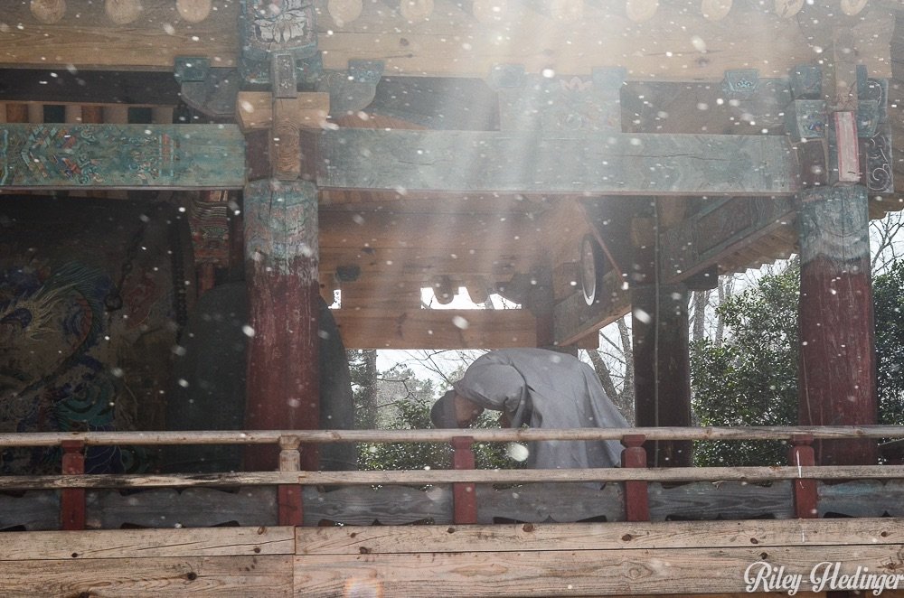 Monk bows after ringing the ceremonial bell at Seonamsa Temple in Suncheon, South Korea