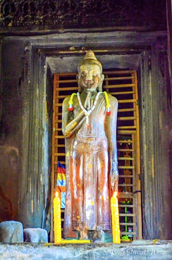 Discolored Buddha Statue inside Angkor Wat