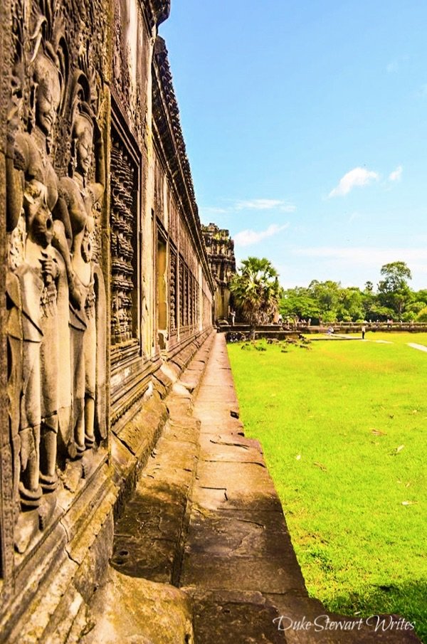 Inside the Angkor Wat complex and carvings on the outer wall