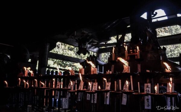 Lighting Candles in Fushimi Inari Temple Kyoto