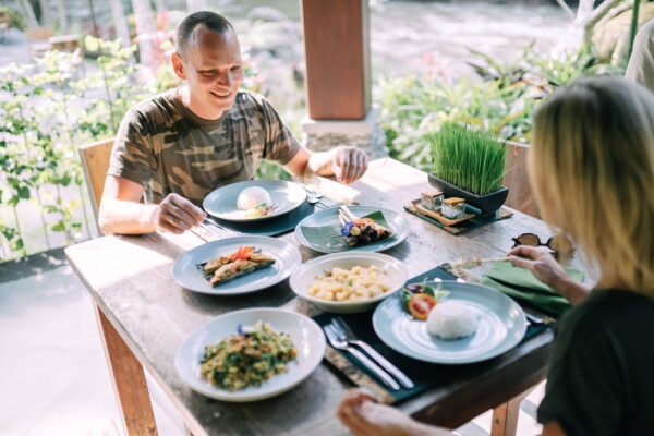 Traveler enjoying a freshly prepared local meal at an outdoor café